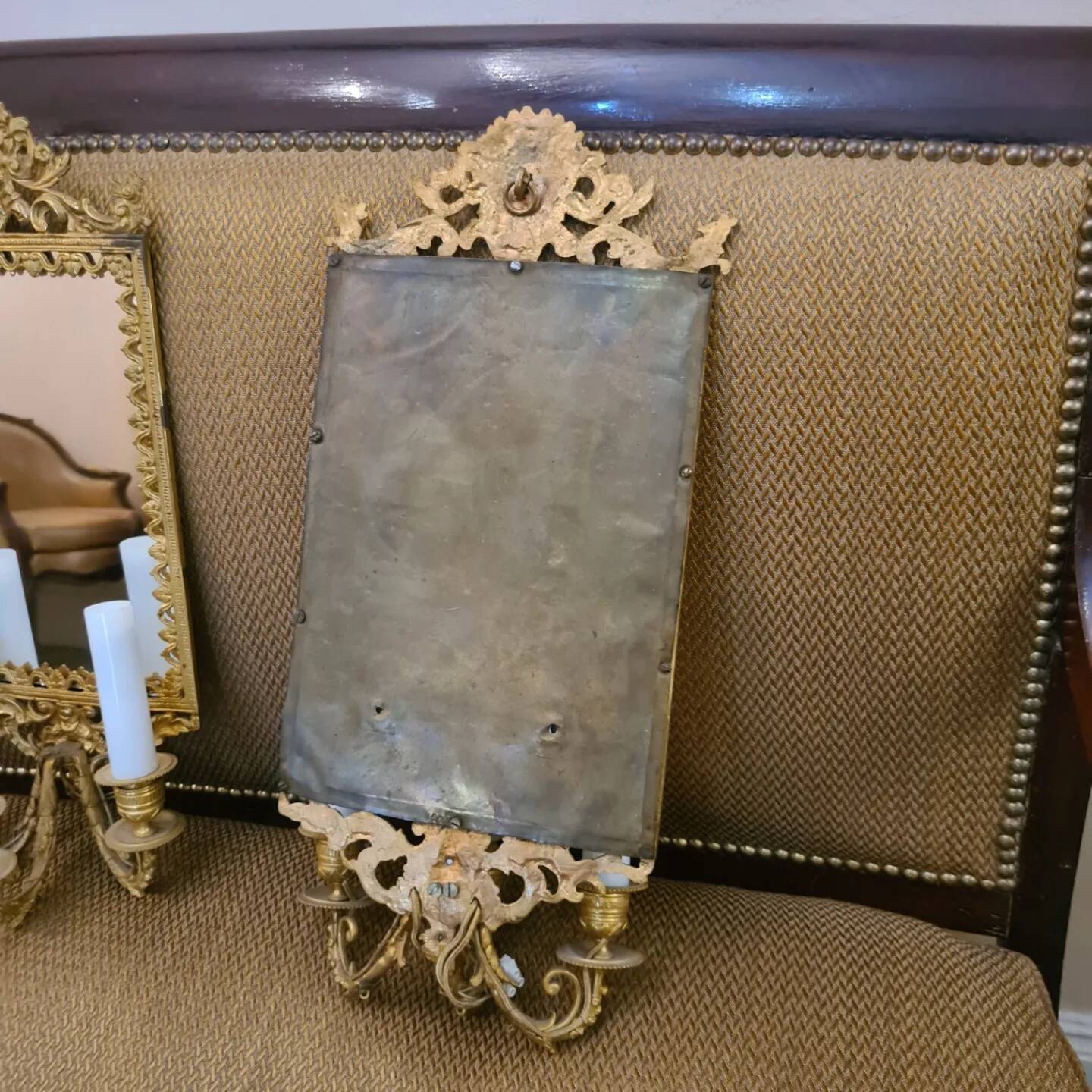 Pair of wall lights with mirror backgrounds with 3 arms of lights in chiseled and gilded bronze. framing decorated with foliage and masks. louis xiv style