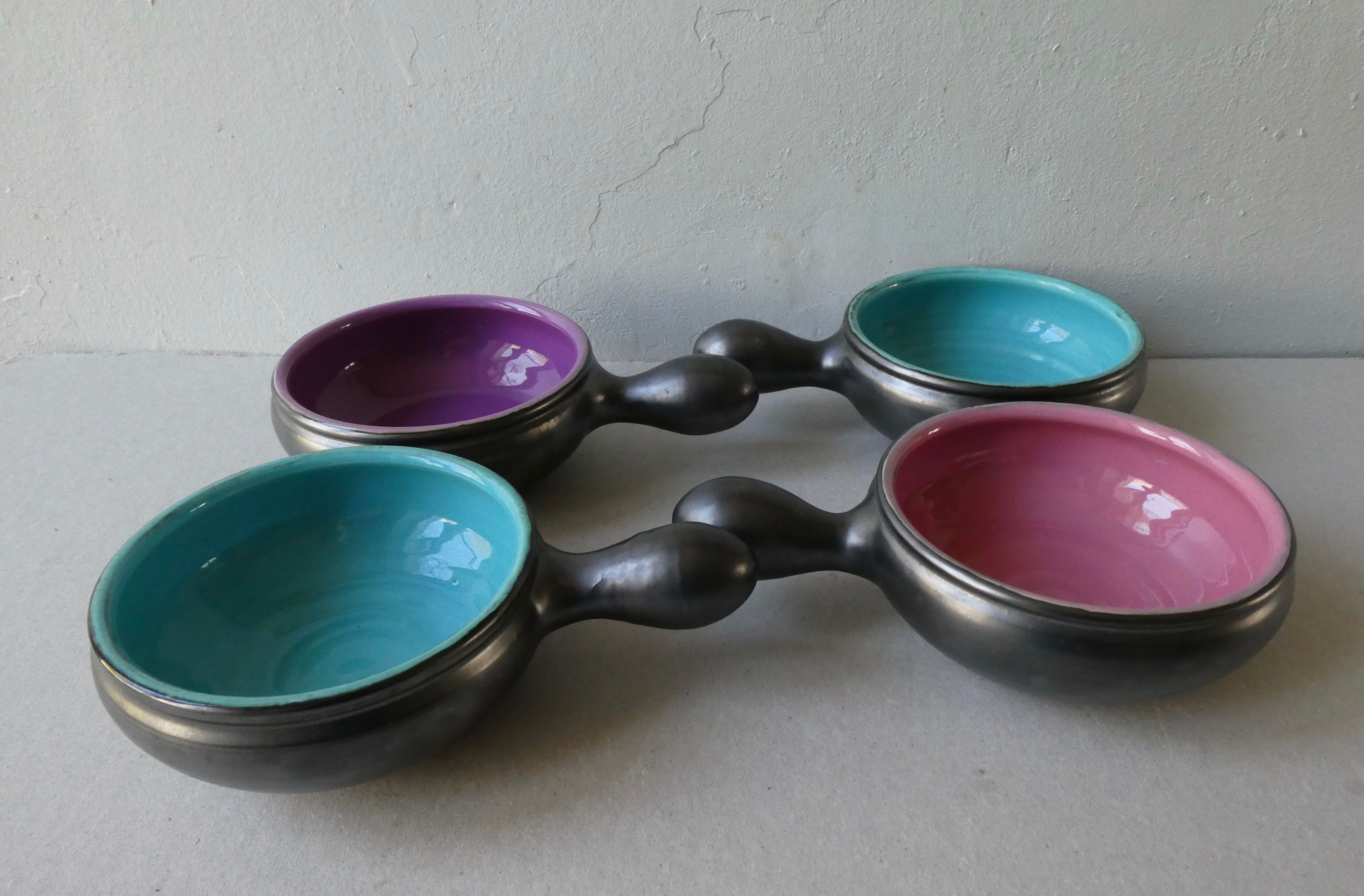 Lot of 4 black and colored ceramic cups