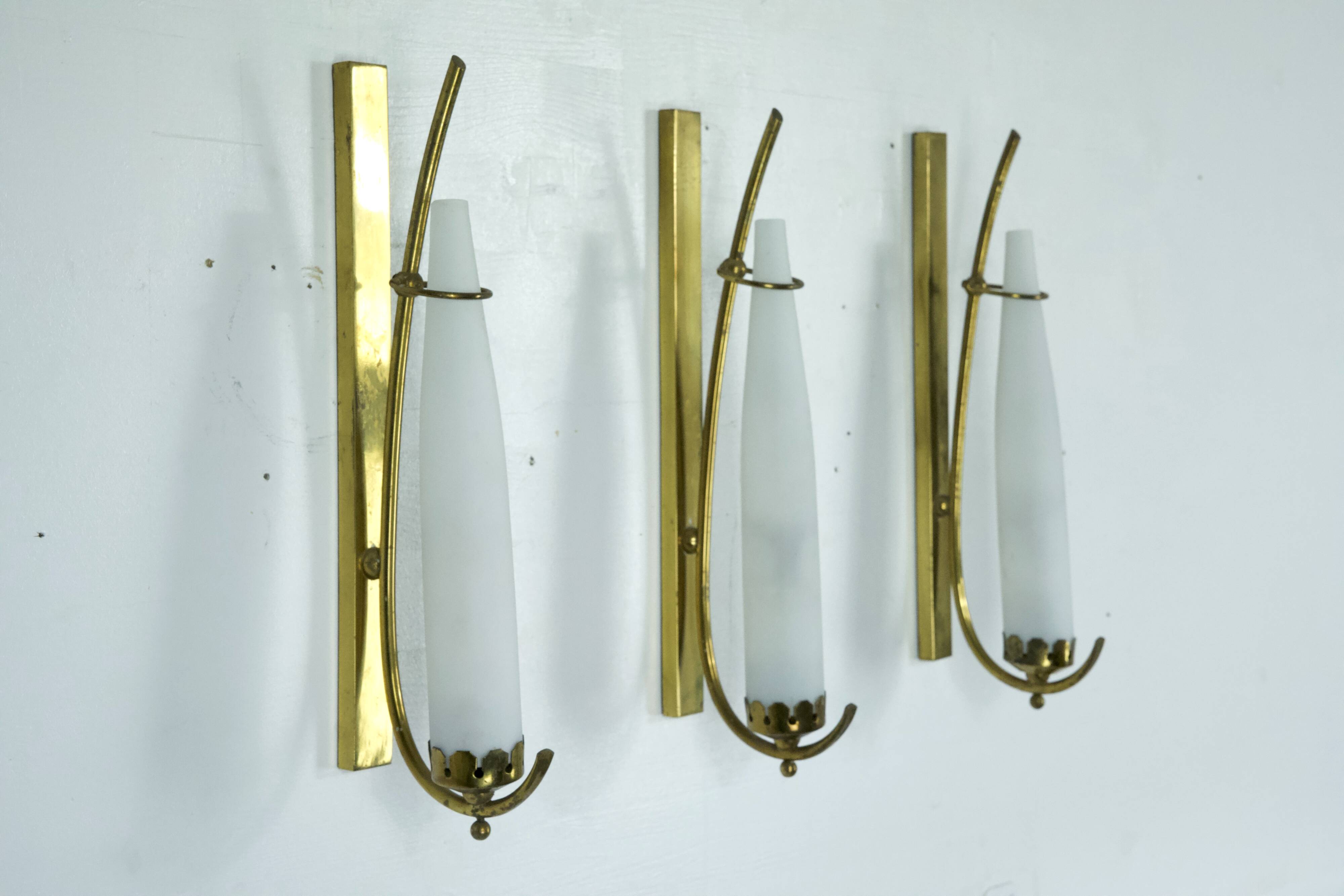 Set of three sconces in brass and triplex opaline glass. Italy 1950s