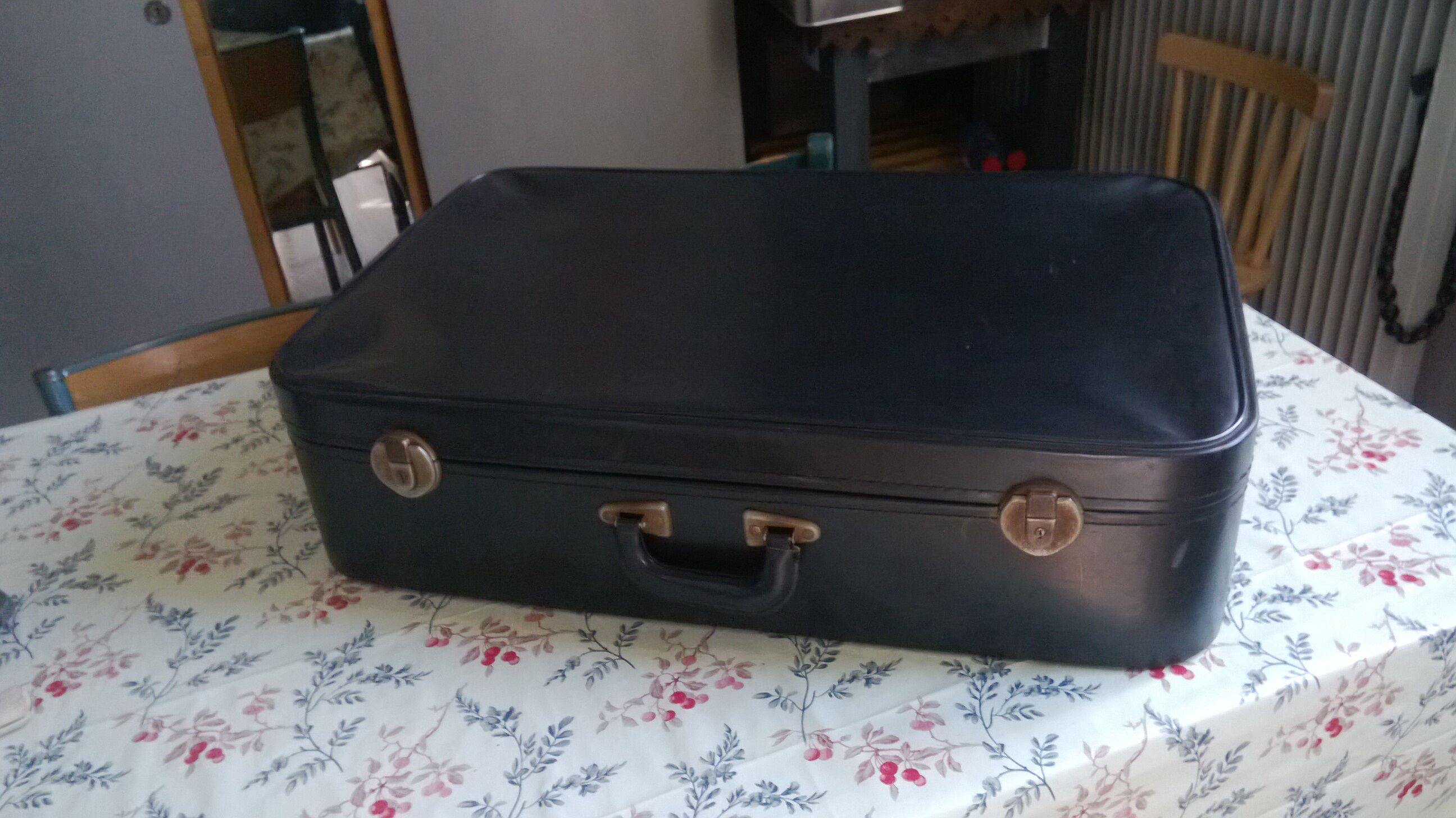 Black vintage suitcase in plastic and 