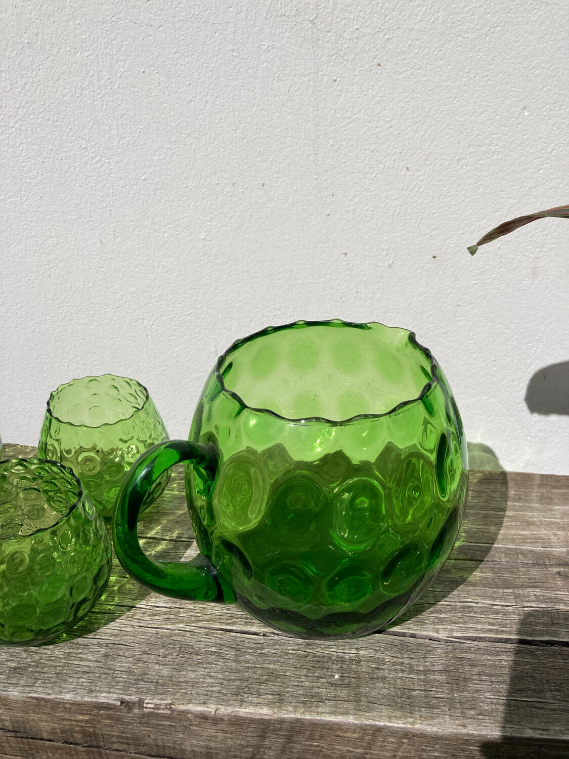 4 green water glasses and vintage blown glass carafe