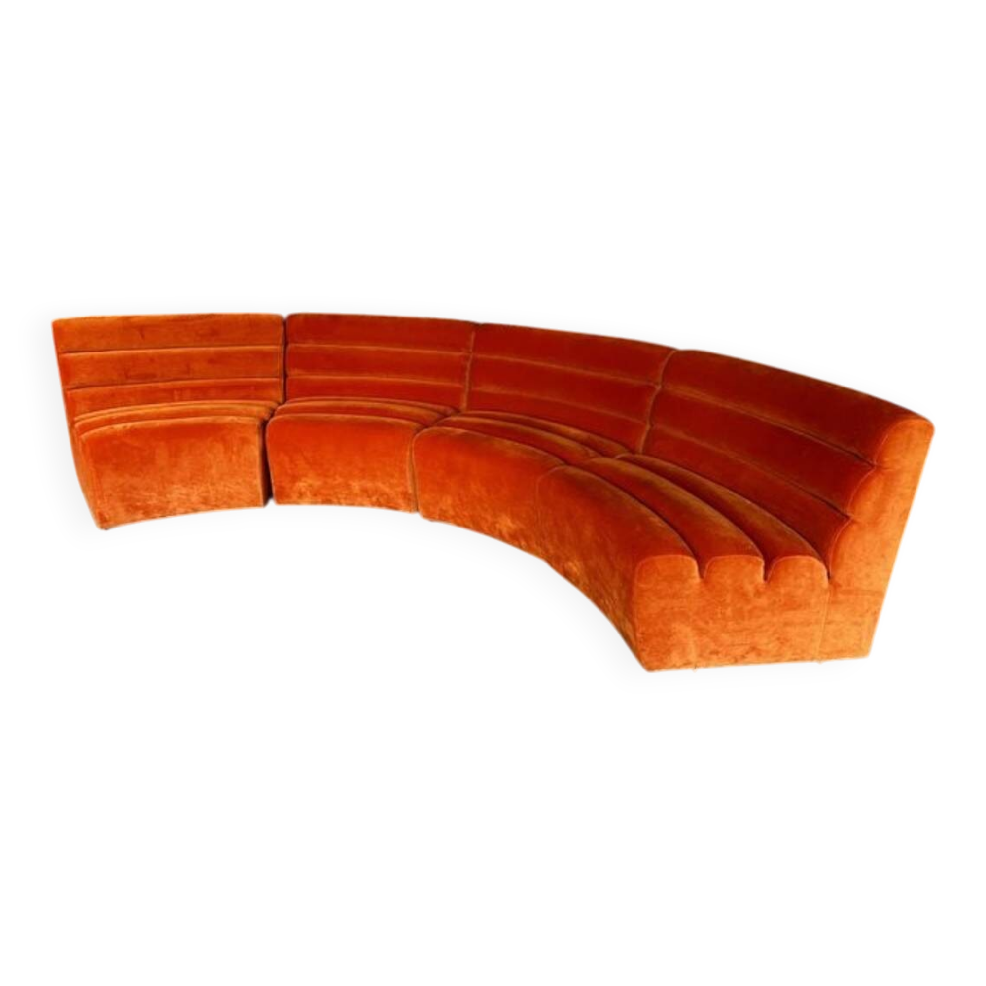 Burnt orange modular sofa for four with a futuristic design.