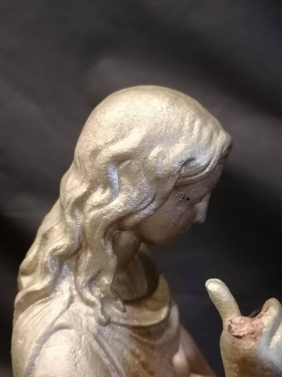 Statuette of a woman in gilded cast iron (Joan of Arc?)