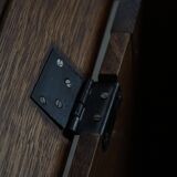 Modern Danish oak commode with decorative relief sculpture, mid-20th century.