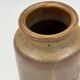 Vintage cylindrical ceramic workshop vase with speckled brown glaze.