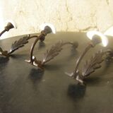 Trio of vintage coat hooks.