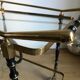 Vintage rolling golden and black dessert in brass and glass