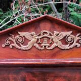 Mahogany pediment mirror with Empire-style cariatids. Return from Egypt