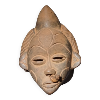 Terracotta mask from the Punu people of Gabon.