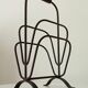 Brutalist wrought iron magazine rack from the 1960s.