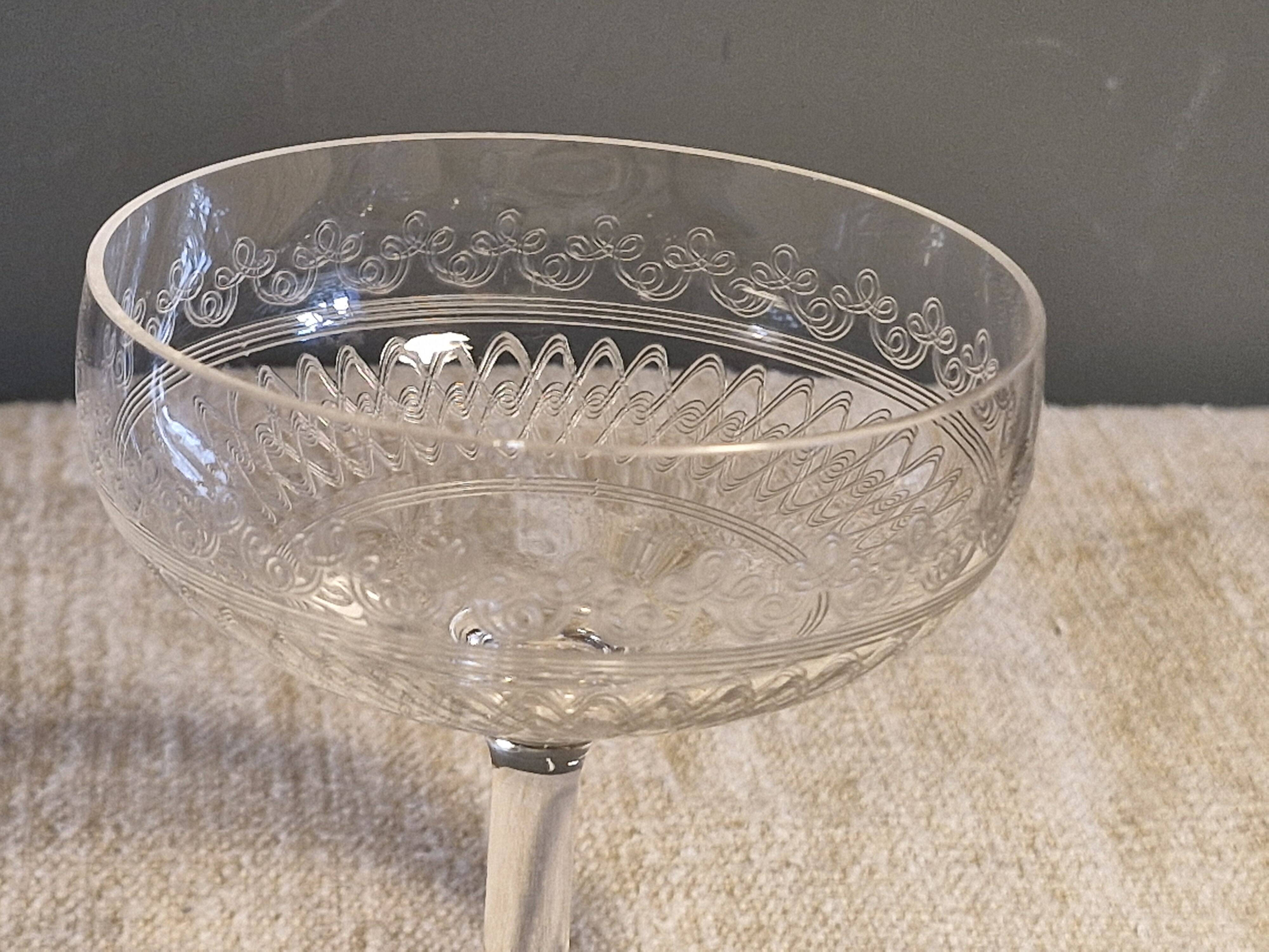 8 antique Baccarat crystal champagne coupes with engraved decoration.