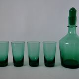 Set of a carafe and 4 designer glasses in green glass from the 70s