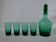 Set of a carafe and 4 designer glasses in green glass from the 70s