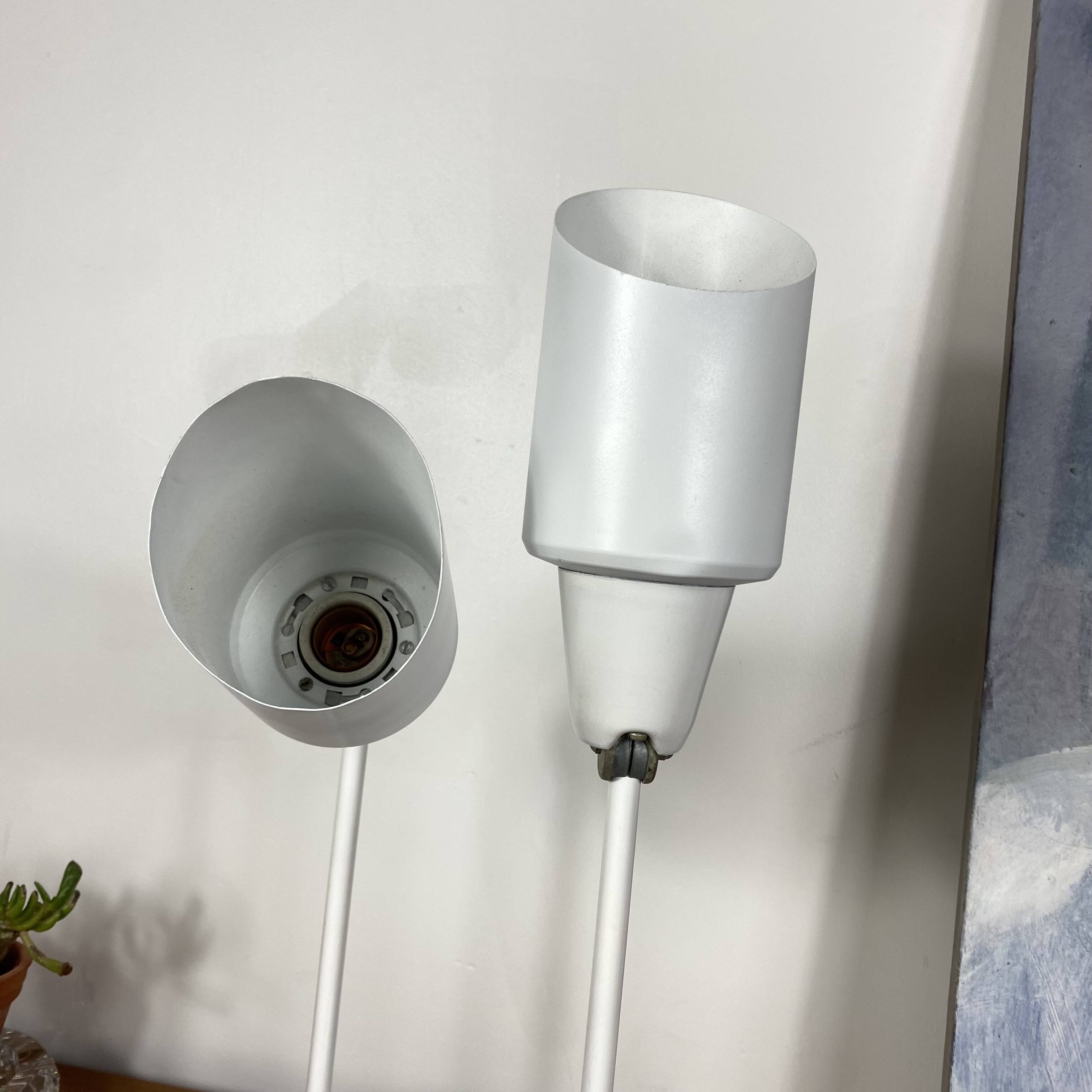 Pair of old industrial adjustable wall sconces in white metal.