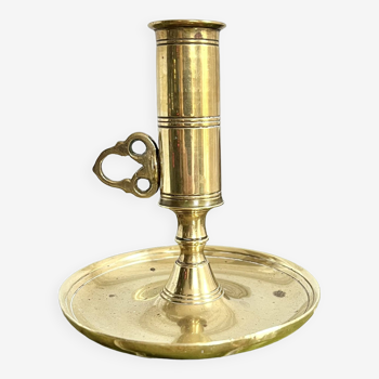 Brass hand and push candle holder