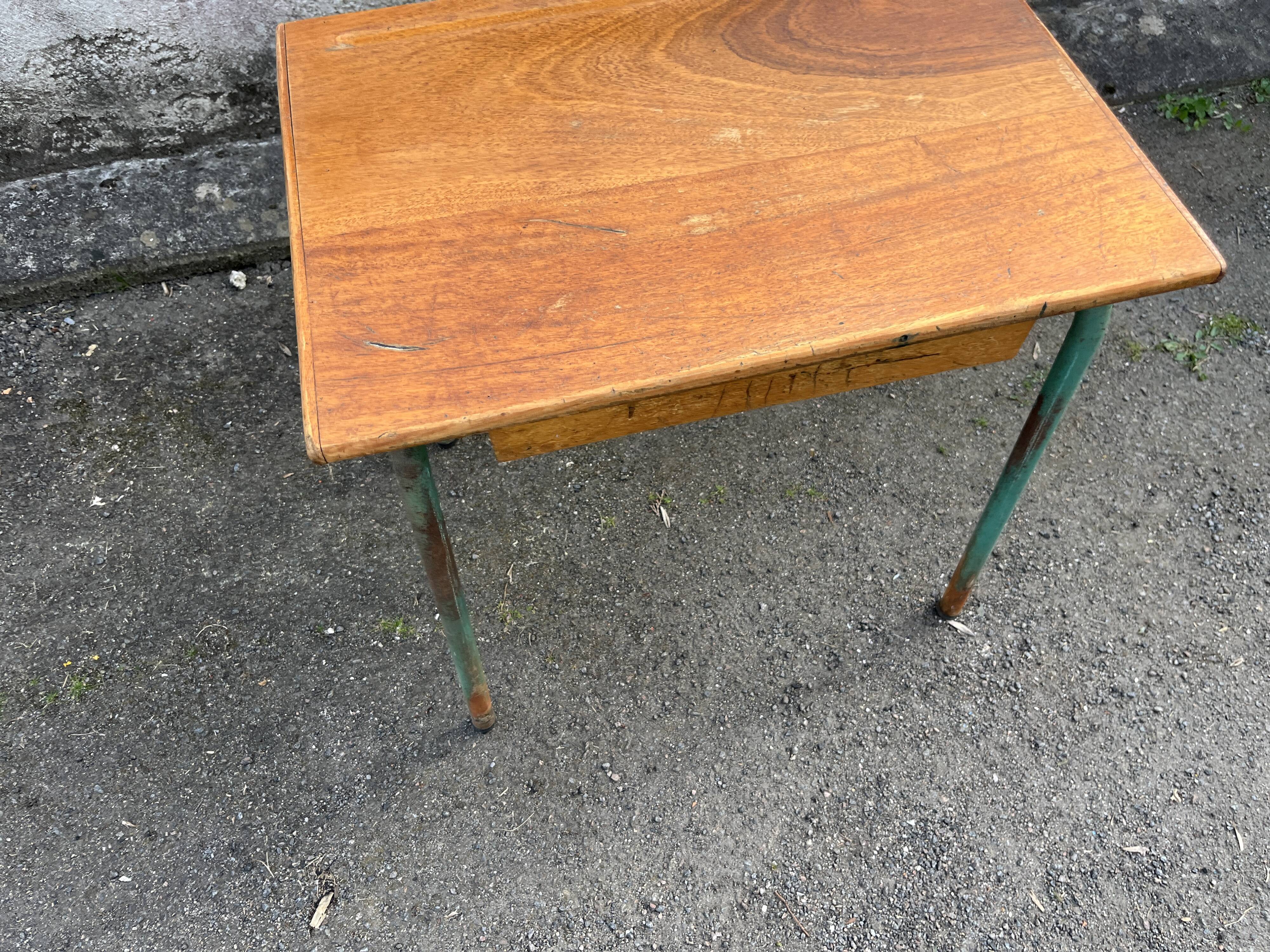 Vintage school desk made of wood and green metal - inkwell hole - antique.