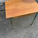 Vintage school desk made of wood and green metal - inkwell hole - antique.