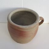 Ancient sandstone pot at one handle