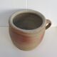 Ancient sandstone pot at one handle