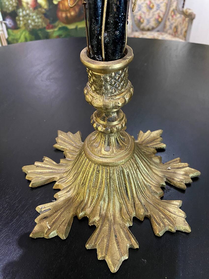 Table lamp with four light arms and globes shaped like bunches of grapes.