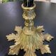 Table lamp with four light arms and globes shaped like bunches of grapes.