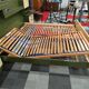Vintage king-size bed with headboard furniture and built-in radio.