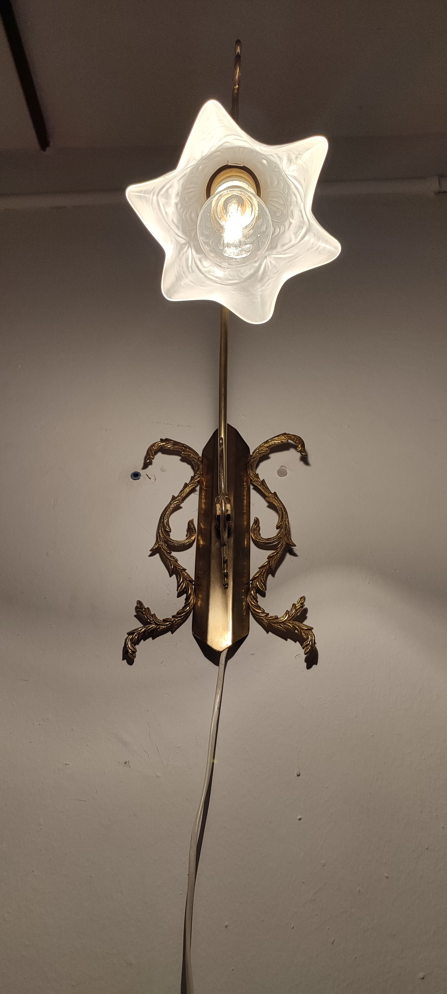Bronze Modernist wall lamp. Spain, 1930s.