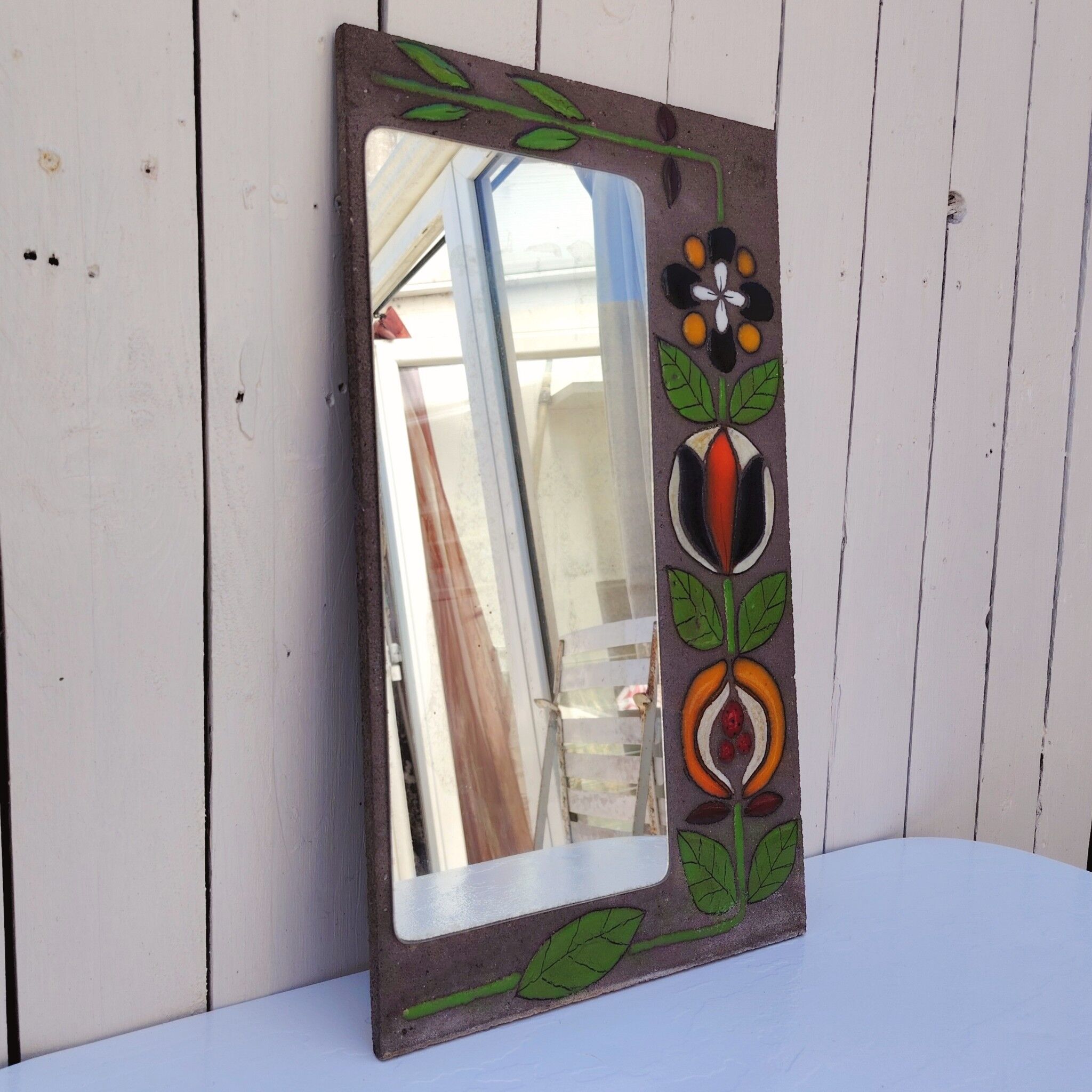 Miroir pierre de lave, fleurs émaillées, années 60-70