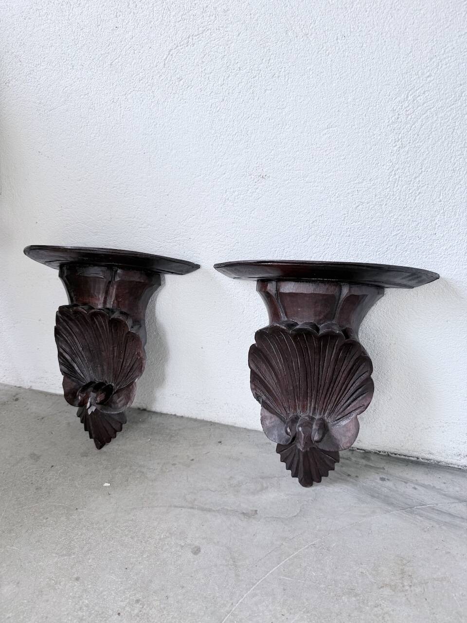 Pair of carved Italian wall consoles