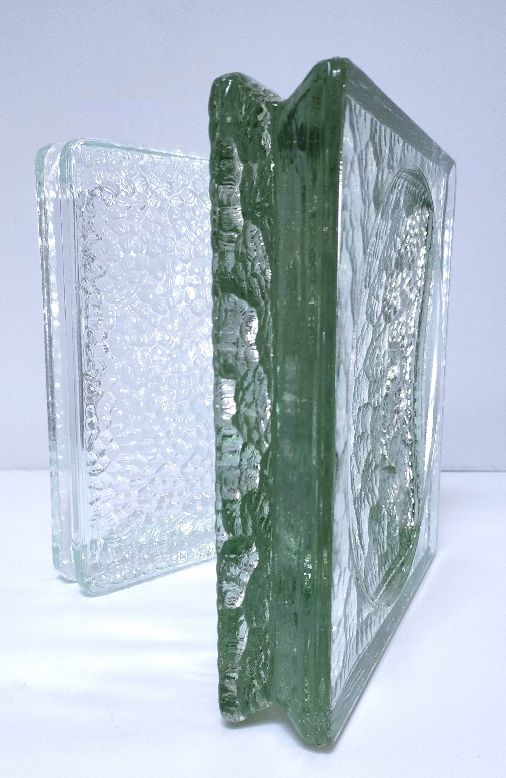 Two designer glass paving pockets