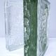 Two designer glass paving pockets