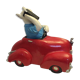 Dog toy driving his red car
