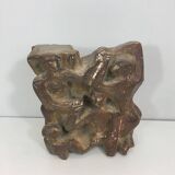 Plaster sculpture depicting a group of 3 figures