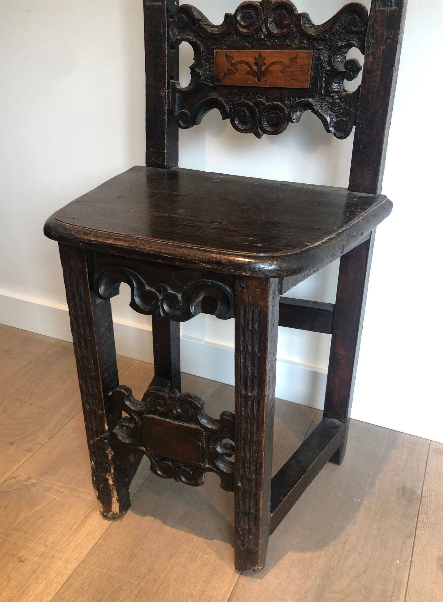 Set of an armchair and a pair of chairs in Italian Renaissance walnut