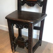 Set of an armchair and a pair of chairs in Italian Renaissance walnut