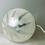 Small black wooden table lamp with frosted glass globe