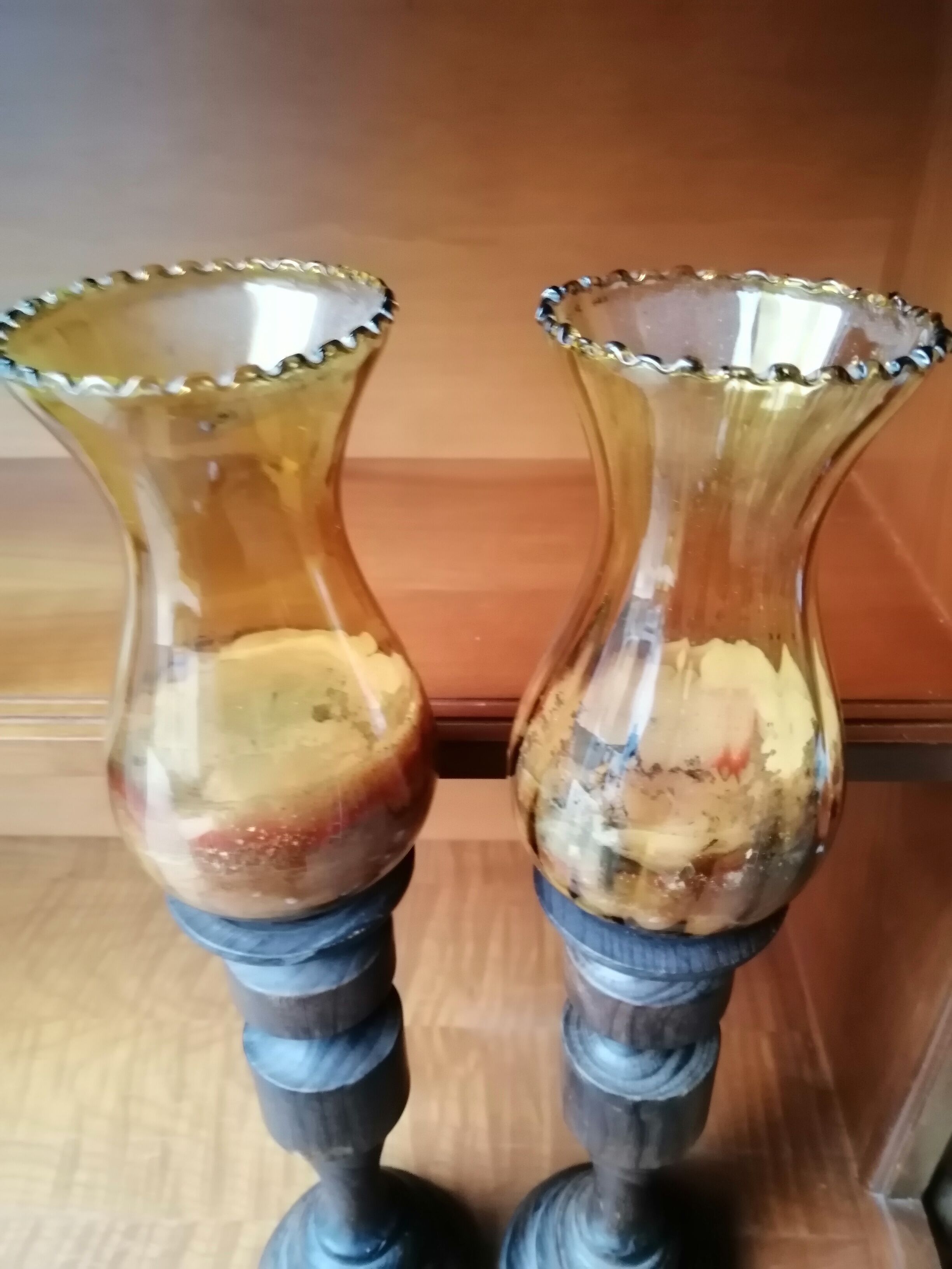 Pair of wooden candle holders and antique glass