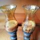 Pair of wooden candle holders and antique glass