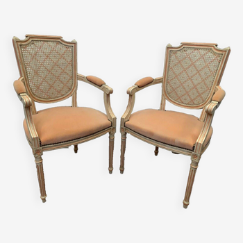 Pair of Louis XVI style armchairs in 20th century patinated beech
