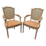 Pair of Louis XVI style armchairs in 20th century patinated beech