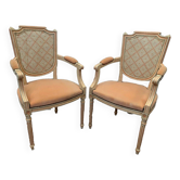 Pair of Louis XVI style armchairs in 20th century patinated beech