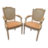 Pair of Louis XVI style armchairs in 20th century patinated beech