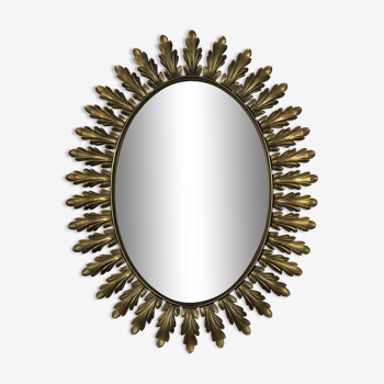 Oval mirror with golden metal acanthus leaves