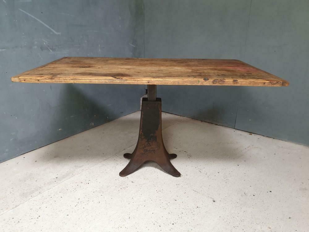 Old table on cast iron machine leg