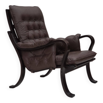 Années 1970, design vintage scandinave, fauteuil, cuir marron, bois cintré.