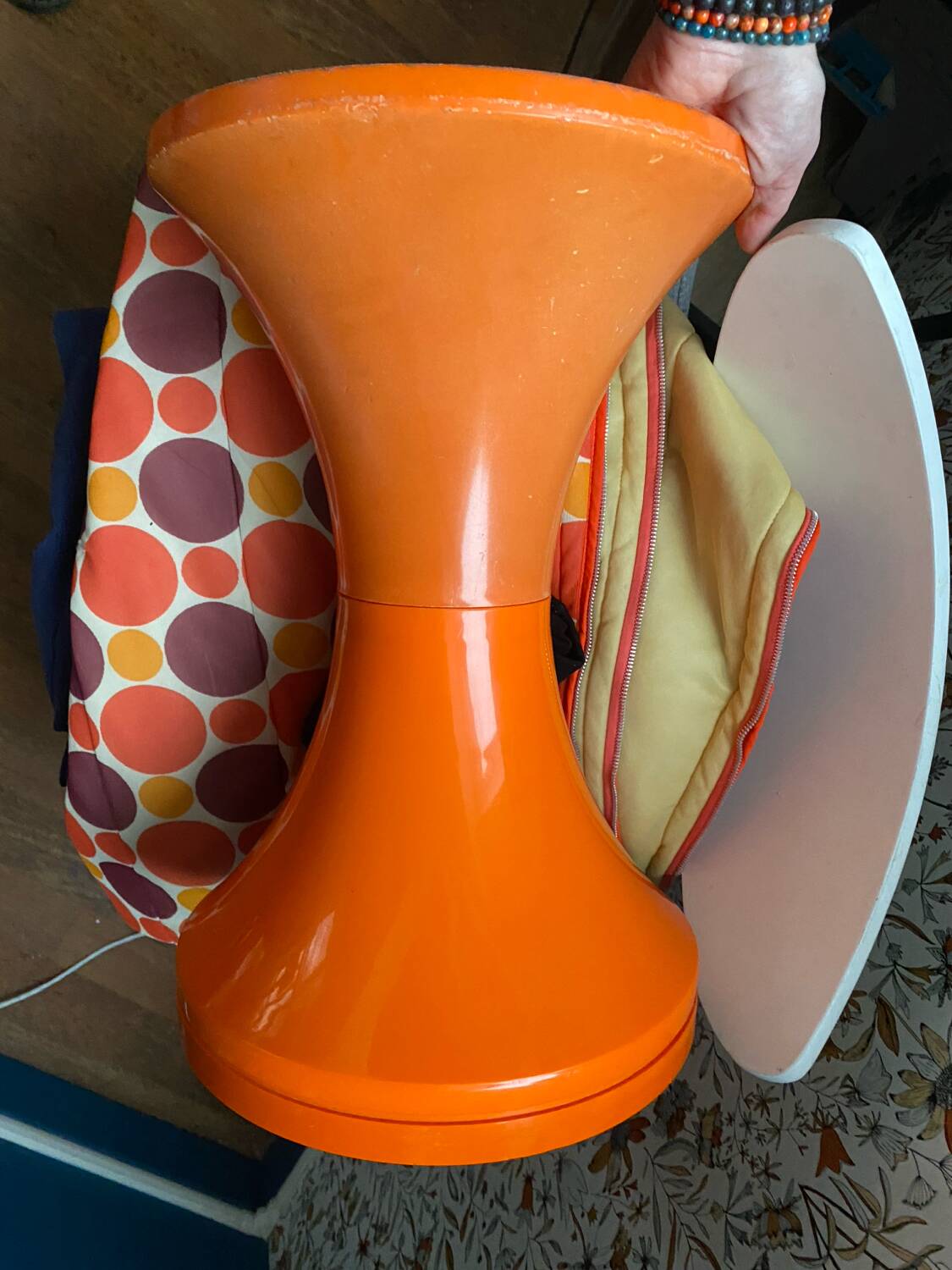 Orange tam-tam by Stamp with integrated pocket.