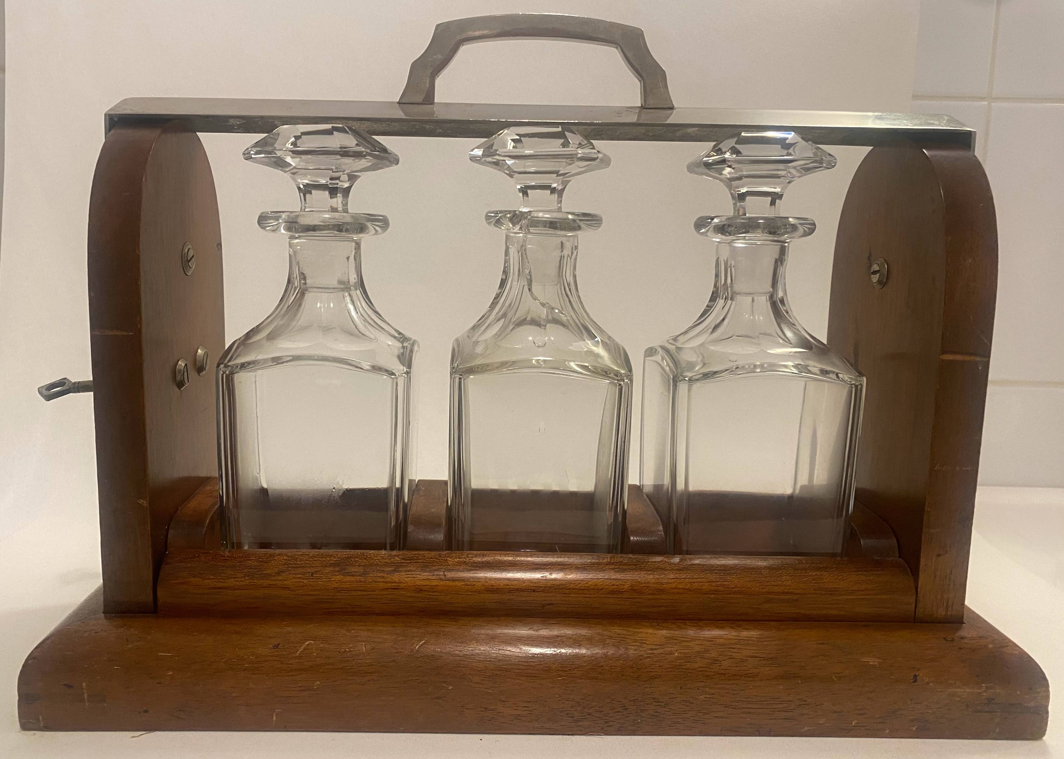 Portable Art Deco liquor cabinet in mahogany & metal with 3 Baccarat crystal bottles.