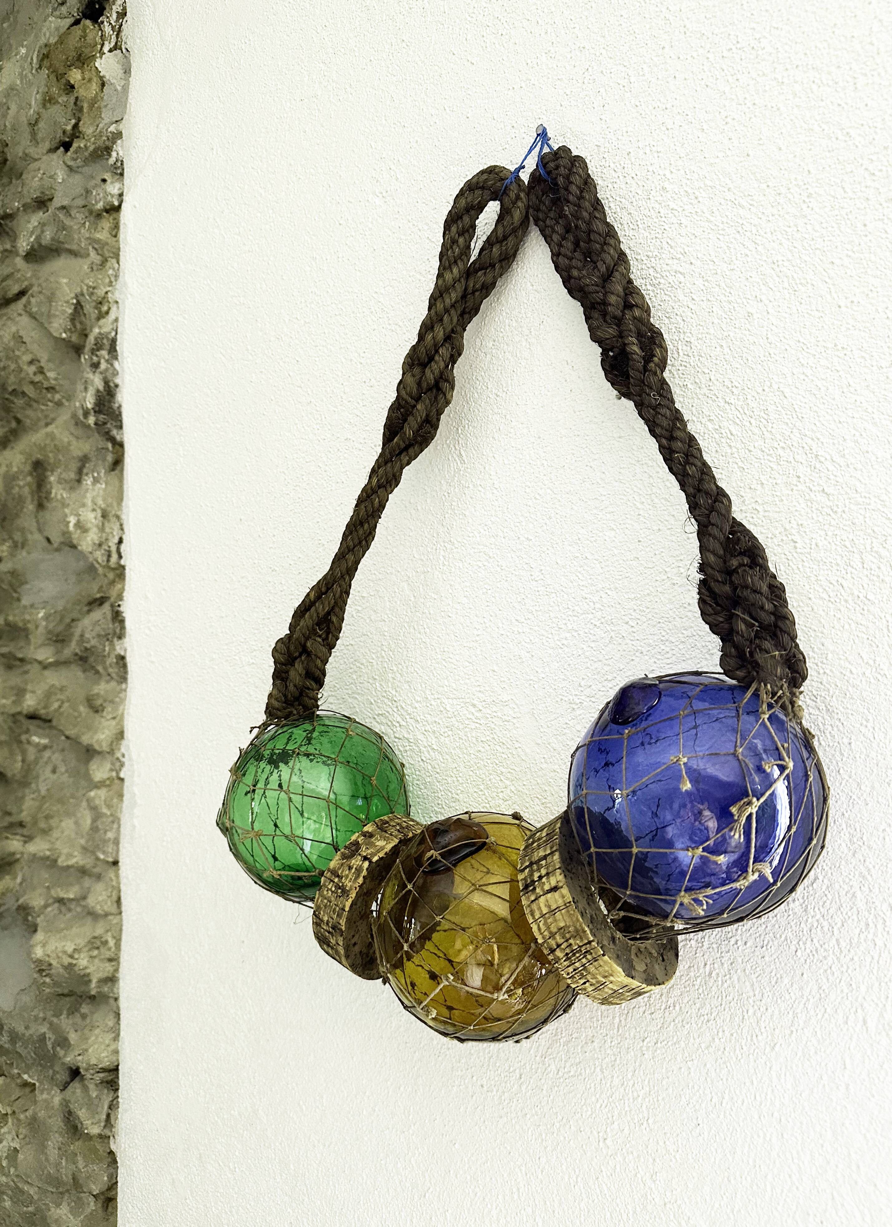Fishing floats made of blown glass, cork, and rope. France, 1960s.