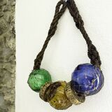 Fishing floats made of blown glass, cork, and rope. France, 1960s.