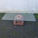 Coffee table with carved wooden legs from India, glass top.